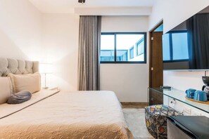 Iron/ironing board, travel cot, WiFi, bed sheets - Modern Condo Steps to 5th Ave and Beach w Rooftop Pool (Playa del Carmen)