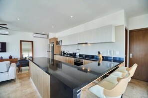 Fridge, microwave, oven, stovetop - Stylish Hideaway w/ Rooftop Jacuzzi, Pool & Gym (Playa del Carmen)