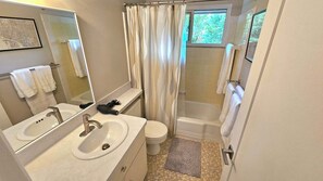 Shower, hair dryer, towels, soap