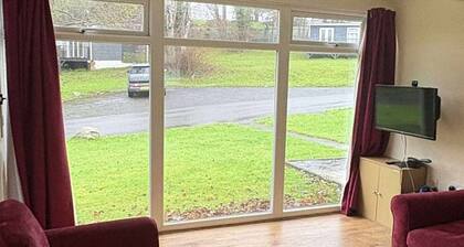 Two bedroom chalet on beautiful and wild Glan Gwna holiday park, with fishing.