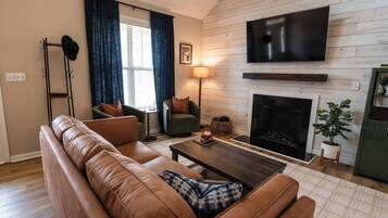 Smart TV, fireplace, table football, books