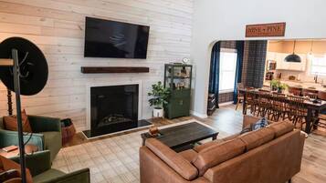 Smart TV, fireplace, table football, books