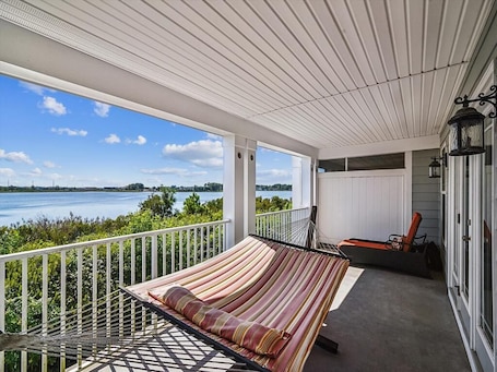 Terrace/patio. 4BR Townhome w/ Pond Views | Decks & Pool + Beach
