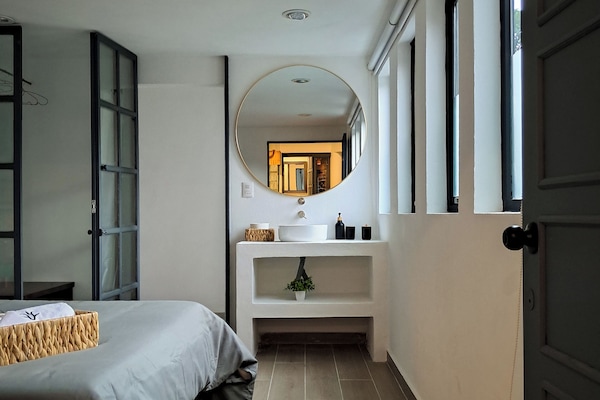 Deluxe Quadruple Room, Courtyard View | Down comforters, minibar, blackout drapes, soundproofing