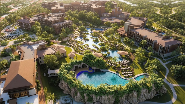 Ein Resort mit mehreren Gebäuden, einem zentralen Poolbereich und umgebender Bepflanzung.