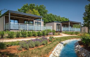 A modern hotel with two guest houses, each featuring a covered outdoor area and a pool. - 2 bedroom stunning (sta)caravan in Vabriga (Vabriga)