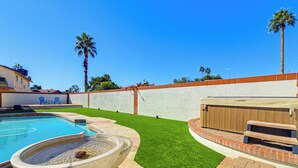 A backyard with a swimming pool, artificial grass, and a barbecue area. - Pool & Personal Bar! 4 Mi to Downtown Mesa Home (Mesa)