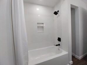 Shower, hair dryer, towels, soap - Experience Timeless Mid-Century Comfort Near Oldsmar’s Best Attractions (Oldsmar)
