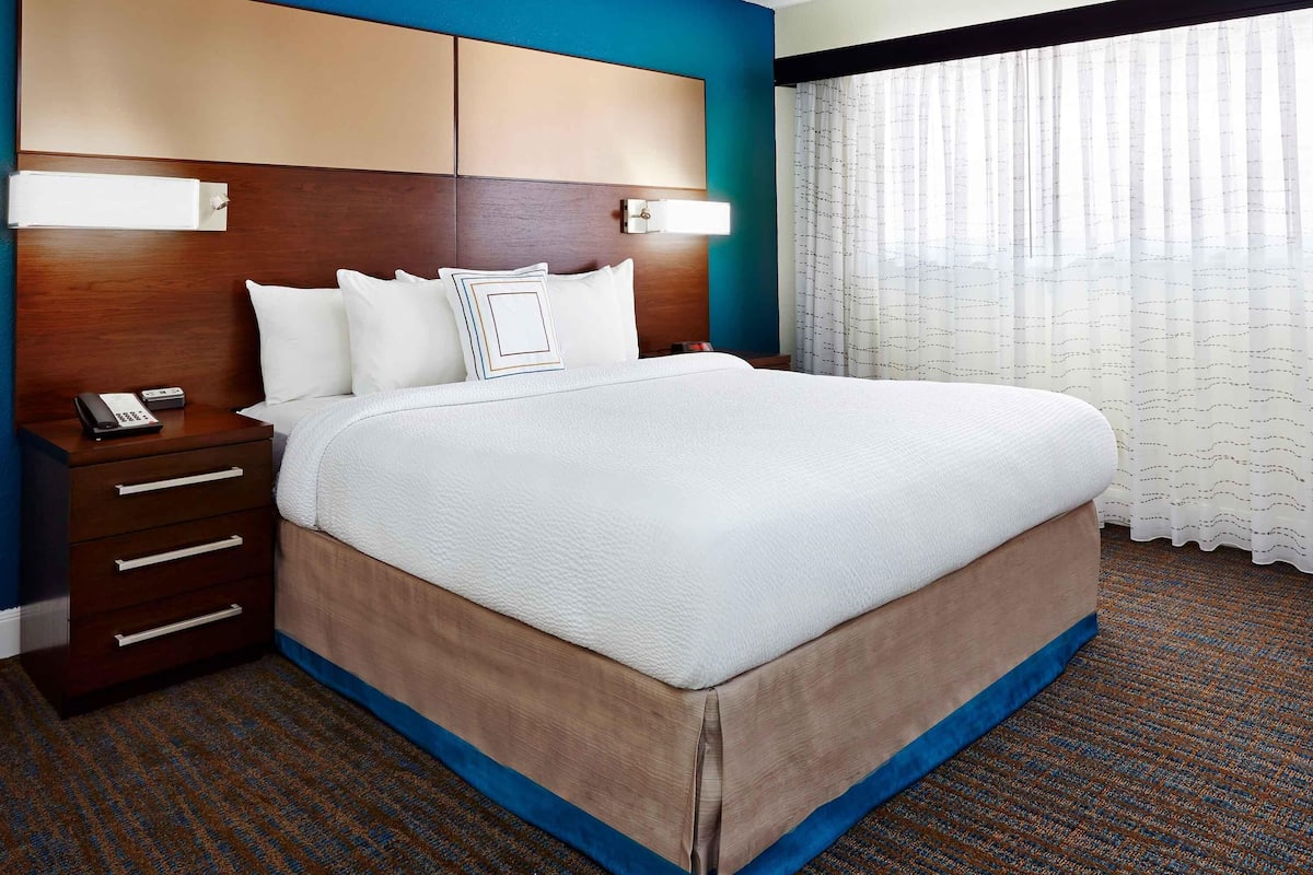 Desk, laptop workspace, blackout drapes, iron/ironing board