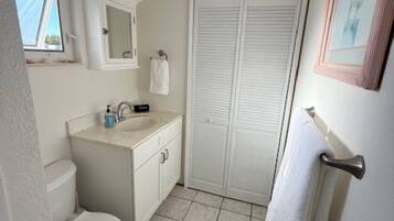 Shower, hair dryer, towels, toilet paper