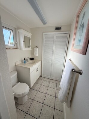 Shower, hair dryer, towels, toilet paper