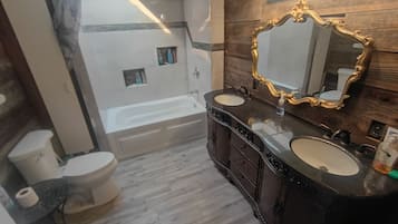 Shower, jetted bath, towels, soap