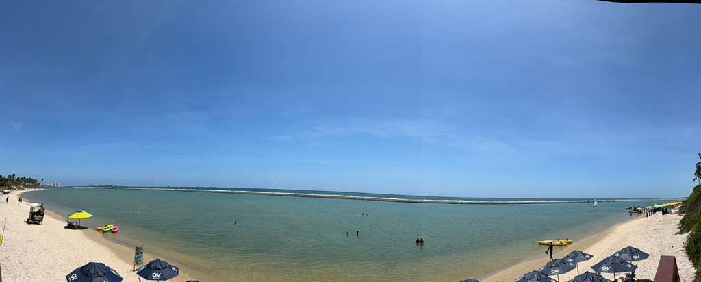 On the beach, beach umbrellas, beach towels, beach bar