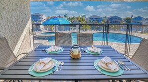 Outdoor dining - NEW! Waterfront Gulf Retreat w/ Heated Pool, Spa, & Mini Golf. (Hernando Beach)