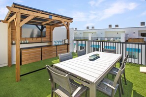 Outdoor dining - Luxury 4-Story Townhome with Heated Pool, Private Elevator, Rooftop Deck & Steps to Madeira Beach (Madeira Beach)