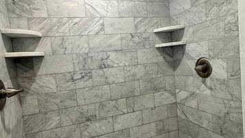 Shower, hair dryer, towels, shampoo