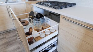 A kitchen with a built-in dishwasher, a stove, and a wooden countertop. - Front beach Charming apartments 2-bedroom apartment  in Cabo Rojo (Cabo Rojo)