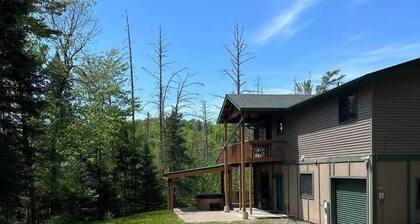 Ski getaway with hill view and hot tub- Lower unit