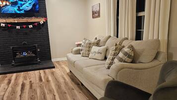 Smart TV, fireplace, books