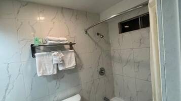 Basic Double Room, 2 Queen Beds | Bathroom | Bathtub, towels, soap, shampoo