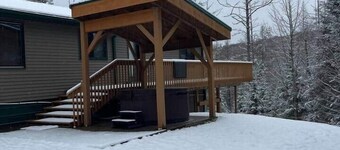 Ski getaway with hill view and hot tub- Upper Unit