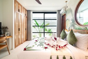 A bedroom with a bed, a view of the ocean, and a tropical-themed wall mural. - Villa Sofra 2BR Private Pool, 350mbps WiFi- Bingin (South Kuta)