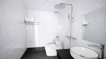 Shower, hair dryer, towels, shampoo