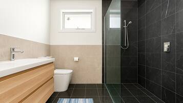 Shower, towels, soap, toilet paper