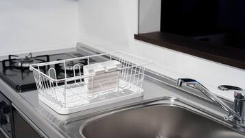 Apartment | Private kitchen | Fridge, microwave, stovetop, cookware/dishes/utensils