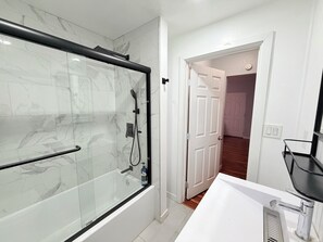 Shower, hair dryer, towels, soap