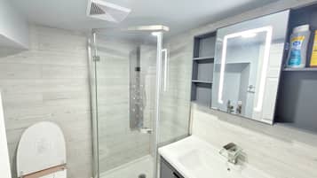 Shower, hair dryer, towels, soap