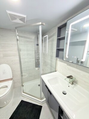 Shower, hair dryer, towels, soap