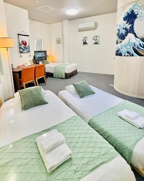 A hotel room with two beds, a desk, and a chair. - R Inn KISHINOSATO (Osaka)
