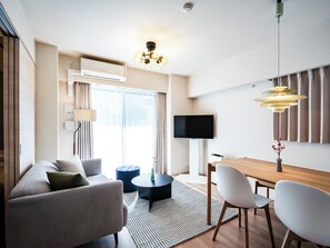 Premier Two-Bedroom Apartment | Living area | 42-inch TV with satellite channels, heated floors - Section L Residence Shibuya (Tokyo)