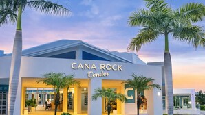 A modern building with the sign "CANA ROCK Condos" indicating a residential complex. - Penthouse at Hard Rock Hotel (Punta Cana)