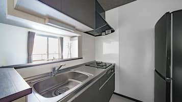 Apartment | Private kitchen | Fridge, microwave, stovetop, high chair