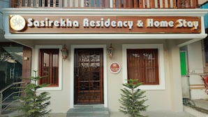 A building with a sign reading 'Sasirekha Residency & Home Stay.' - Sasirekha Residency & Homestay (Puducherry)