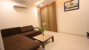 Luksussuite, byutsikt | Oppholdsområde | Printere