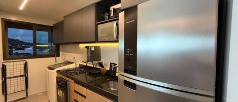 Fridge, microwave, stovetop, cookware/dishes/utensils