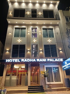 A multi-story hotel with a sign reading "HOTEL RADHA RANI PALACE." - Hotel Radha Rani Palace (Puri)