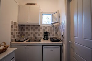 Standard Apartment, 2 Bedrooms, Garden View, Beachside | Private kitchen | Mini-fridge, stovetop, coffee/tea maker, electric kettle