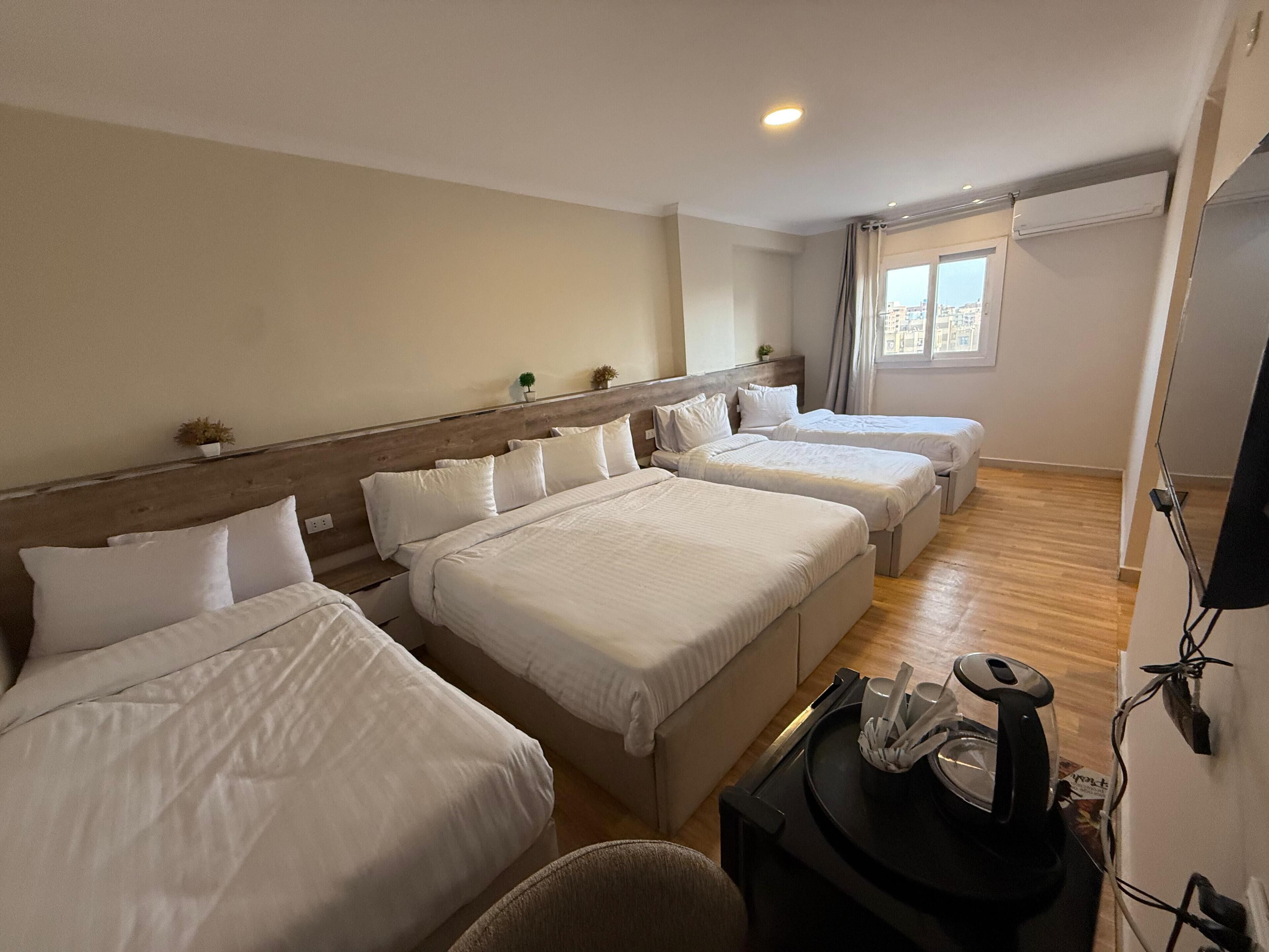 Family Quadruple Room, City View | In-room safe, desk, blackout drapes, soundproofing