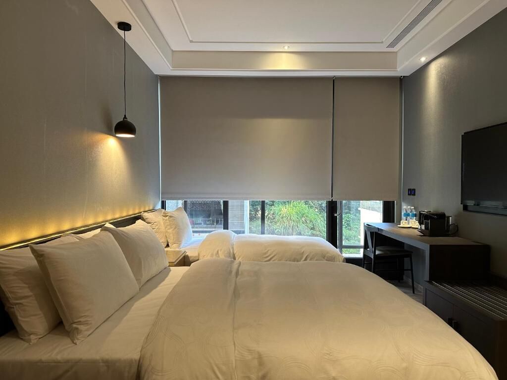 Quarto triplo clássico, vista para a cidade