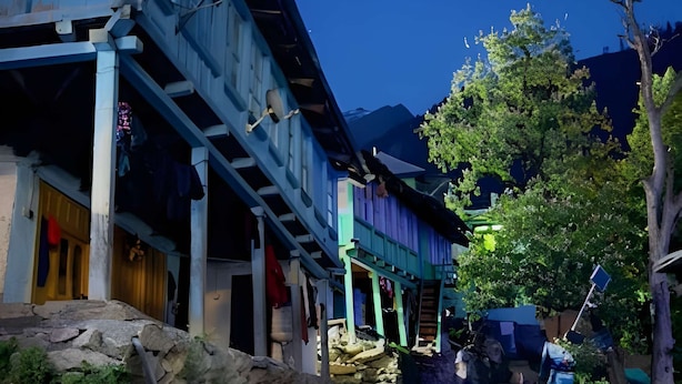 A traditional building with a stone pathway leading to a wooden structure. - Yellowjackets Hotel Tosh (Tosh)