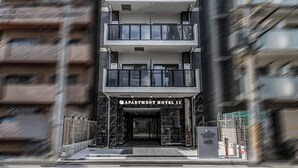 A multi-story building with a sign reading "APARTMENT HOTEL 11". - Apartment Hotel 11 Dotonbori 8 (Osaka)
