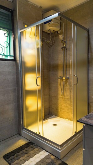 Shower, hair dryer - New 2-Bedroom Apartment in Bwebajja, Kampala (Kampala)