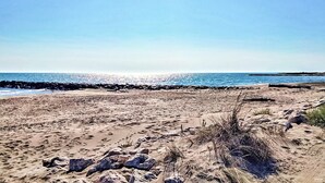 A sandy beach with a rocky shoreline and a clear blue sky. - Gorgeous home in Noves (Noves)