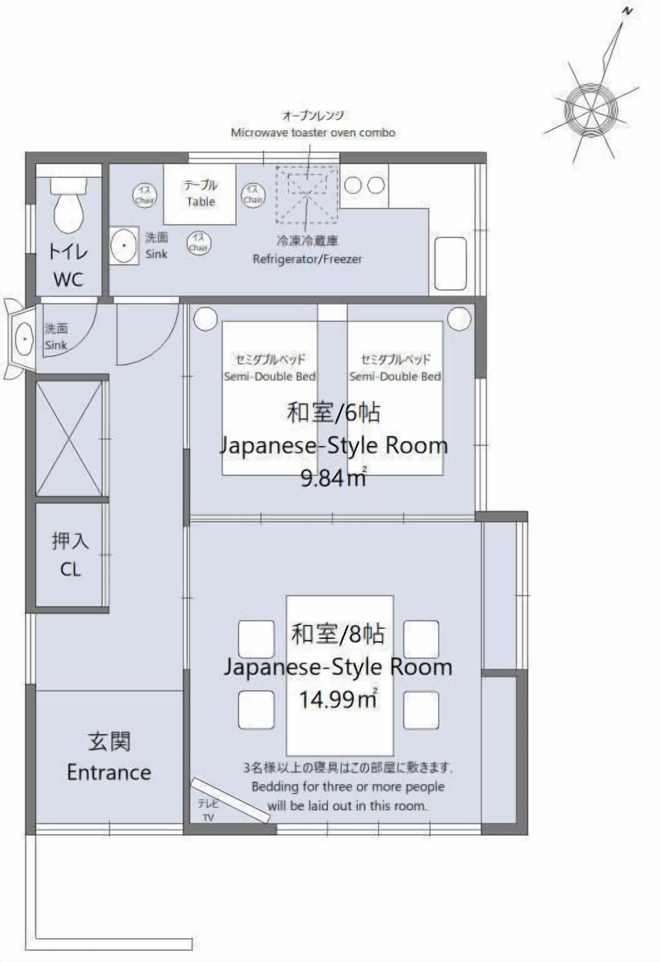 A Japanese-style room layout with a toilet, sink, and a microwave/toaster combo.