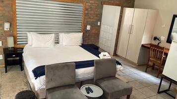 Deluxe Double Room, Garden View | In-room safe, blackout drapes, iron/ironing board, free WiFi