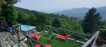 village holiday house with a pool